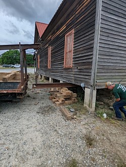 Clearing debris and setting I-beams and trucks